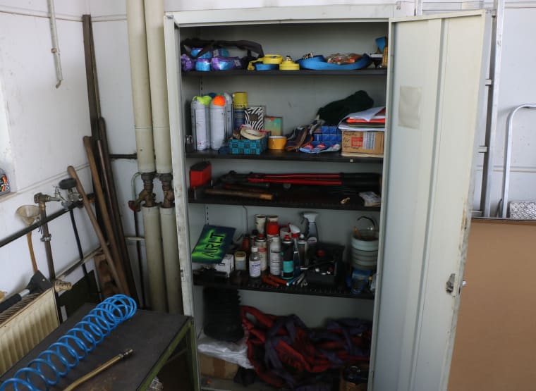 Double-door workshop cabinet with contents